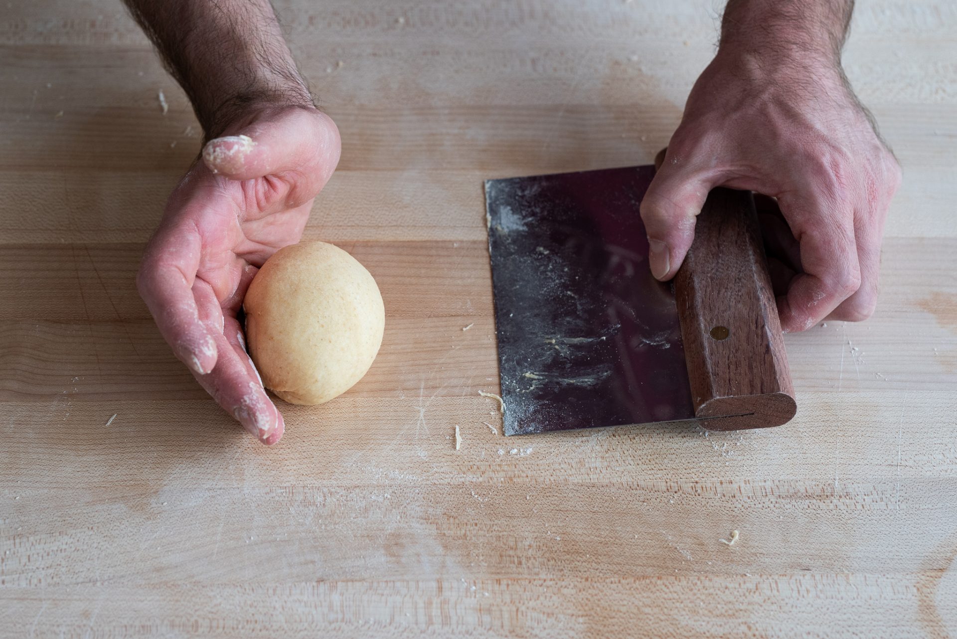Tightly shaping a sourdough roll
