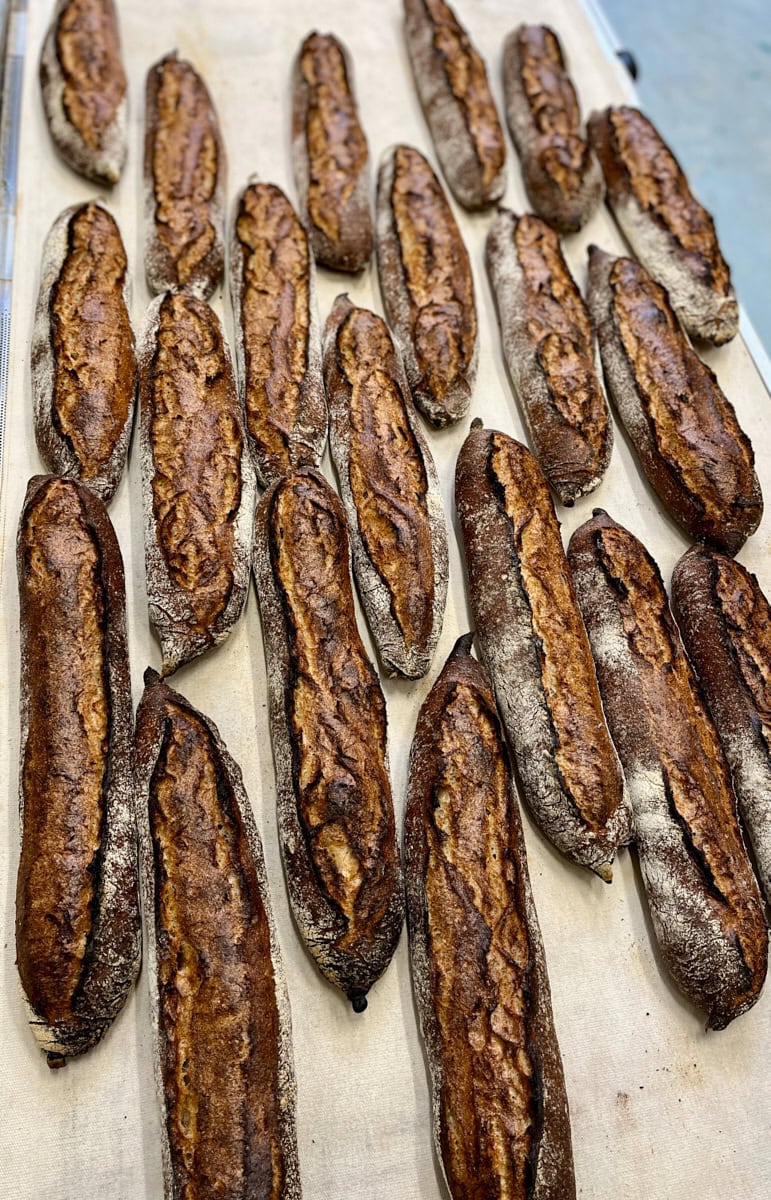 Baguettes coming out of the oven.