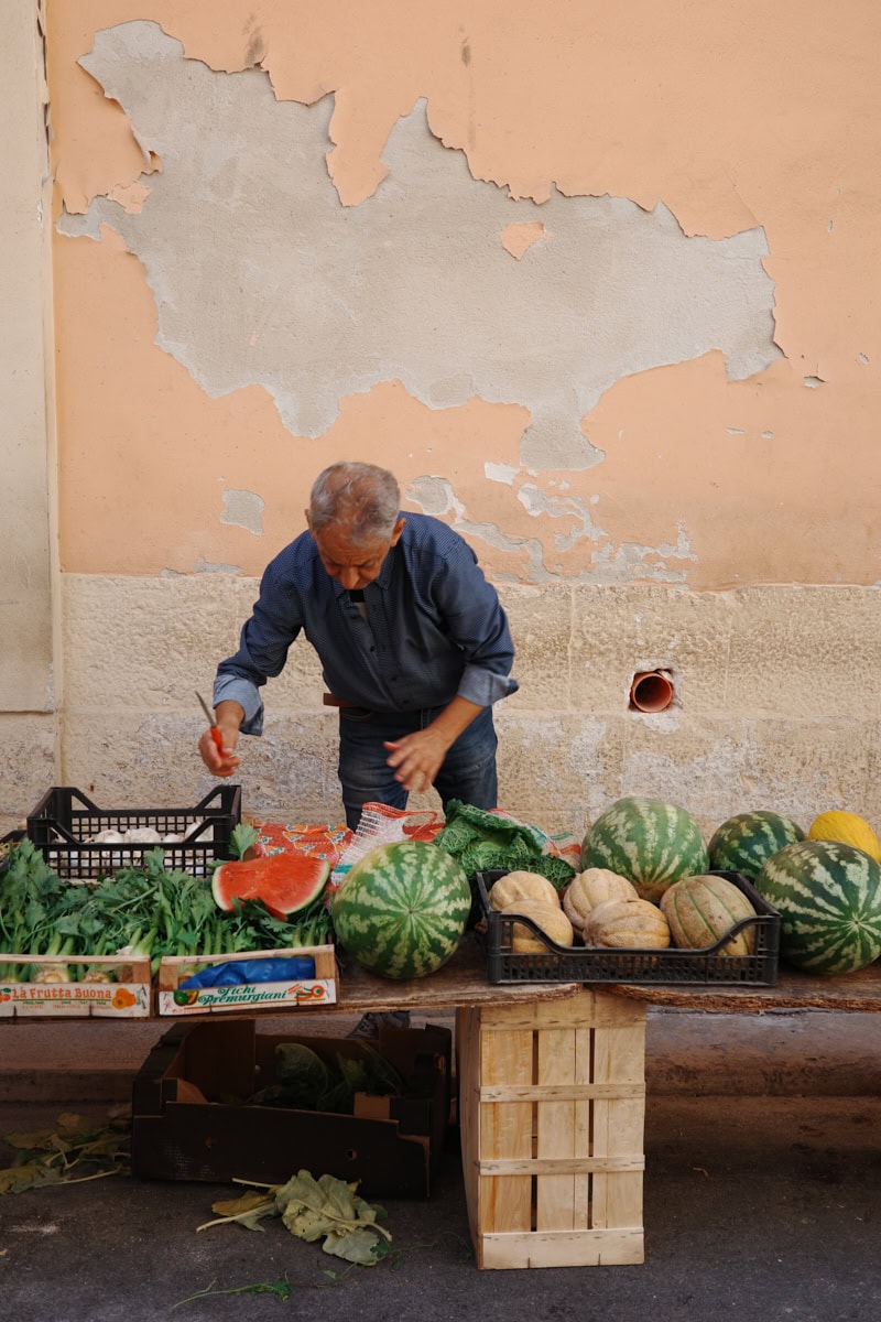 Man selling fruit on the street.