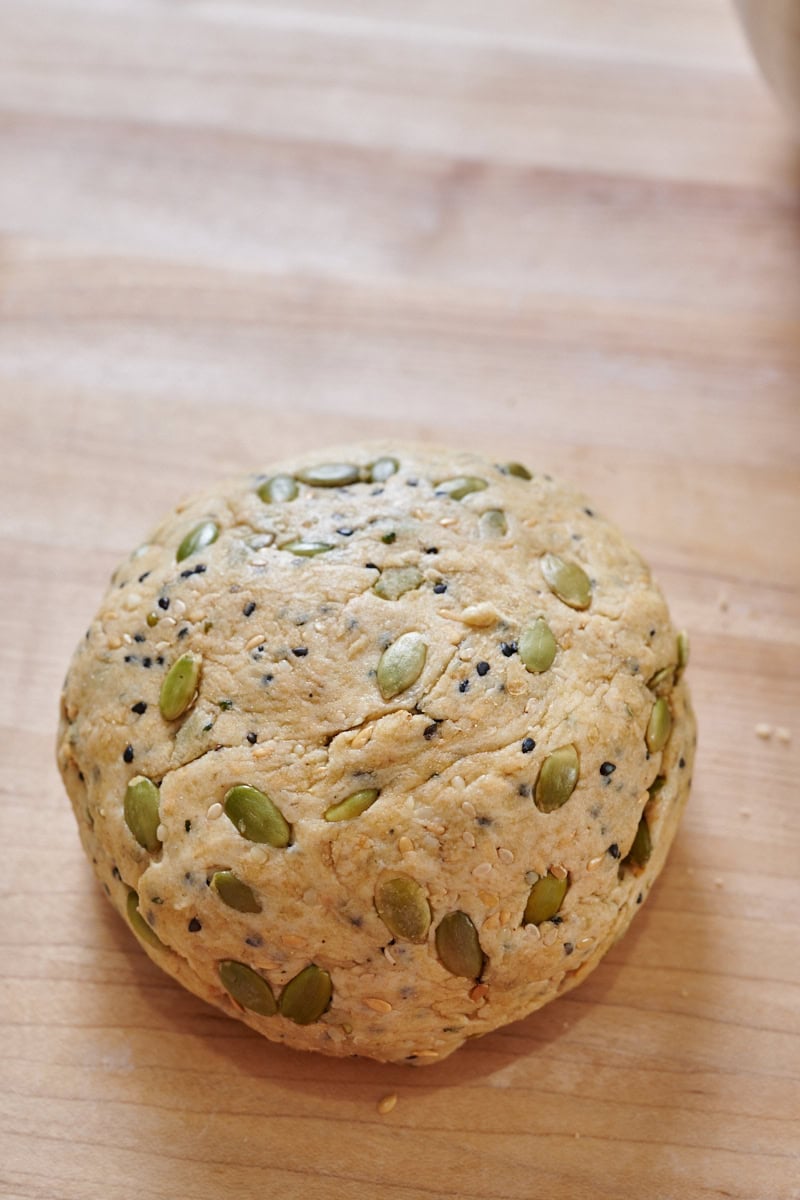 Seeded sourdough discard cracker dough mixed.