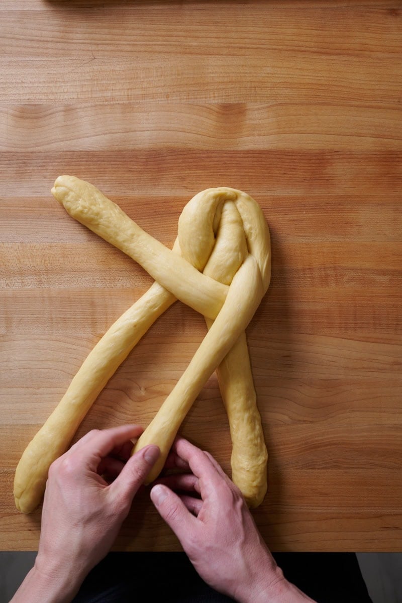 Braiding a 4 strand challah.