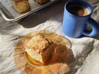 A sourdough discard biscuit sitting on a plate