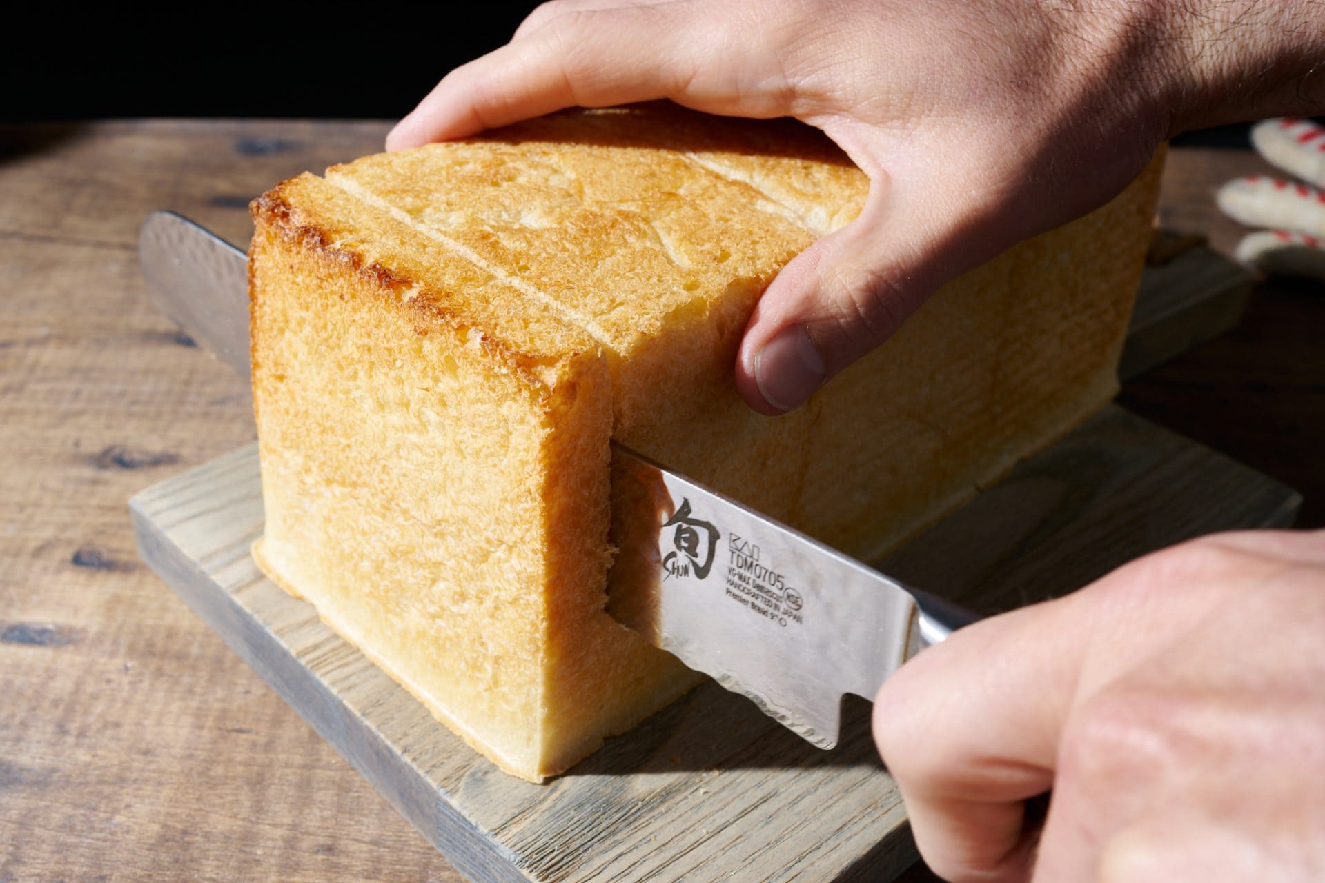 Slicing sourdough Japanese milk bread