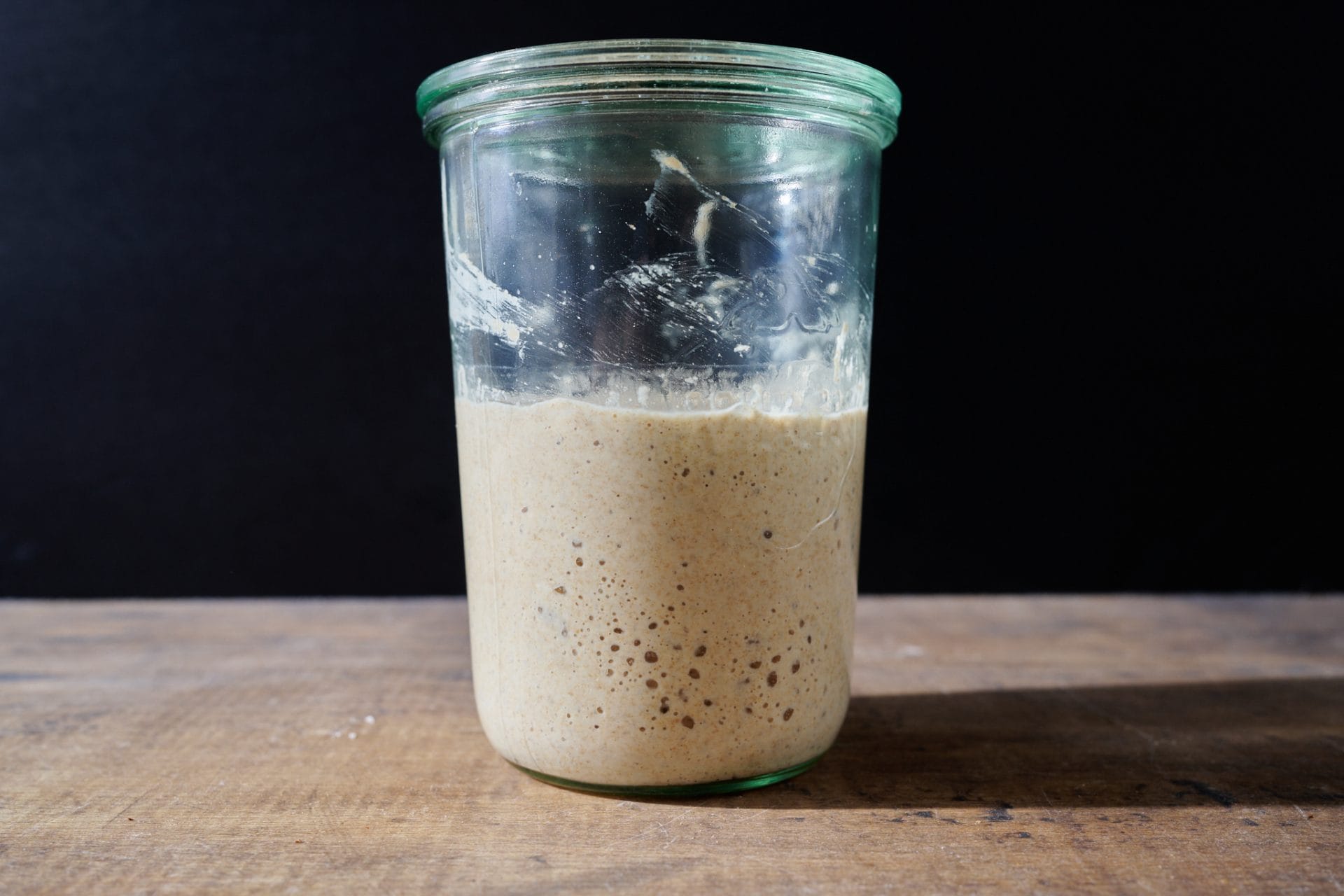 My sourdough starter with strong fermentation after reviving it from the fridge.