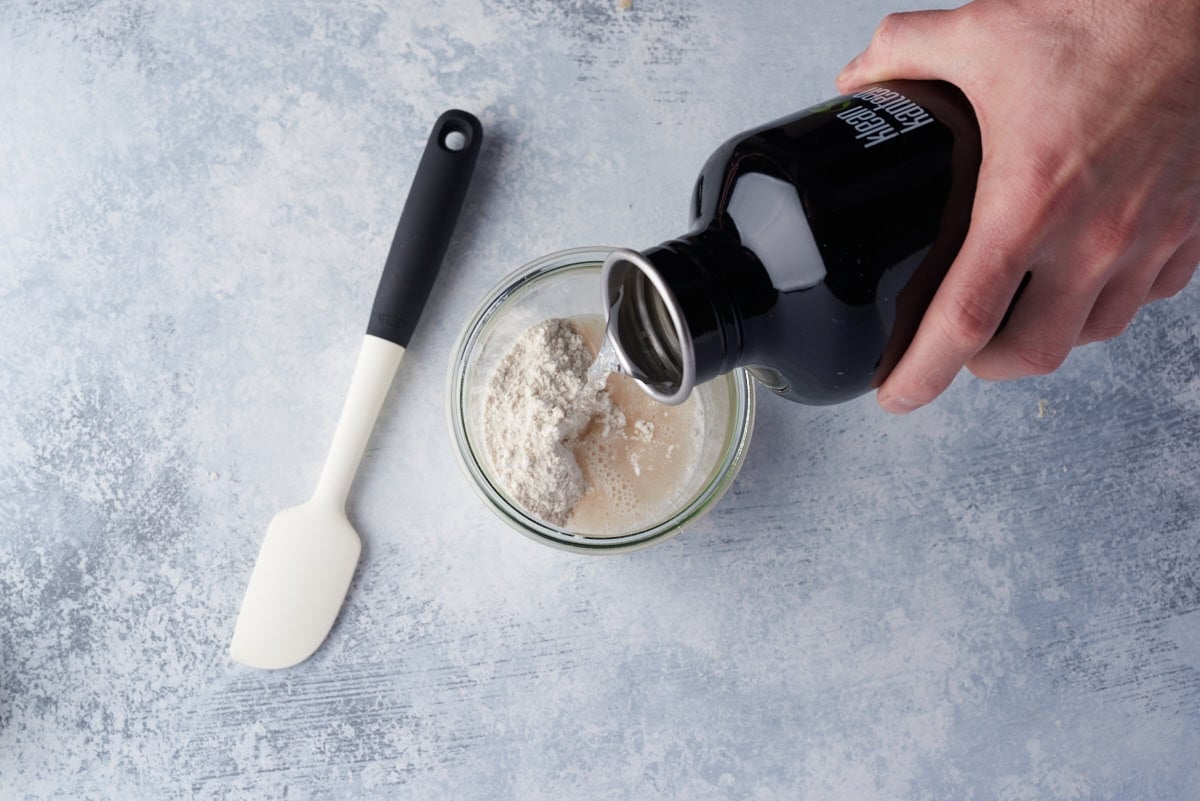 Pouring warmed water before mixing.